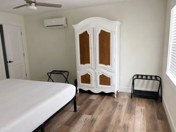 a utility room with cabinets washer and dryer