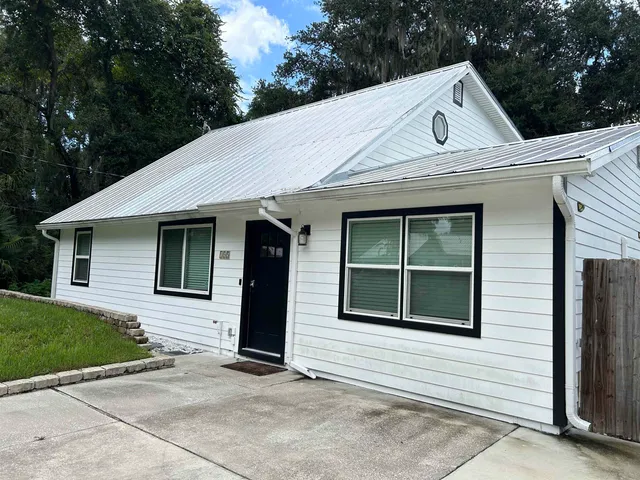 a view of a water fountain in front of a house
