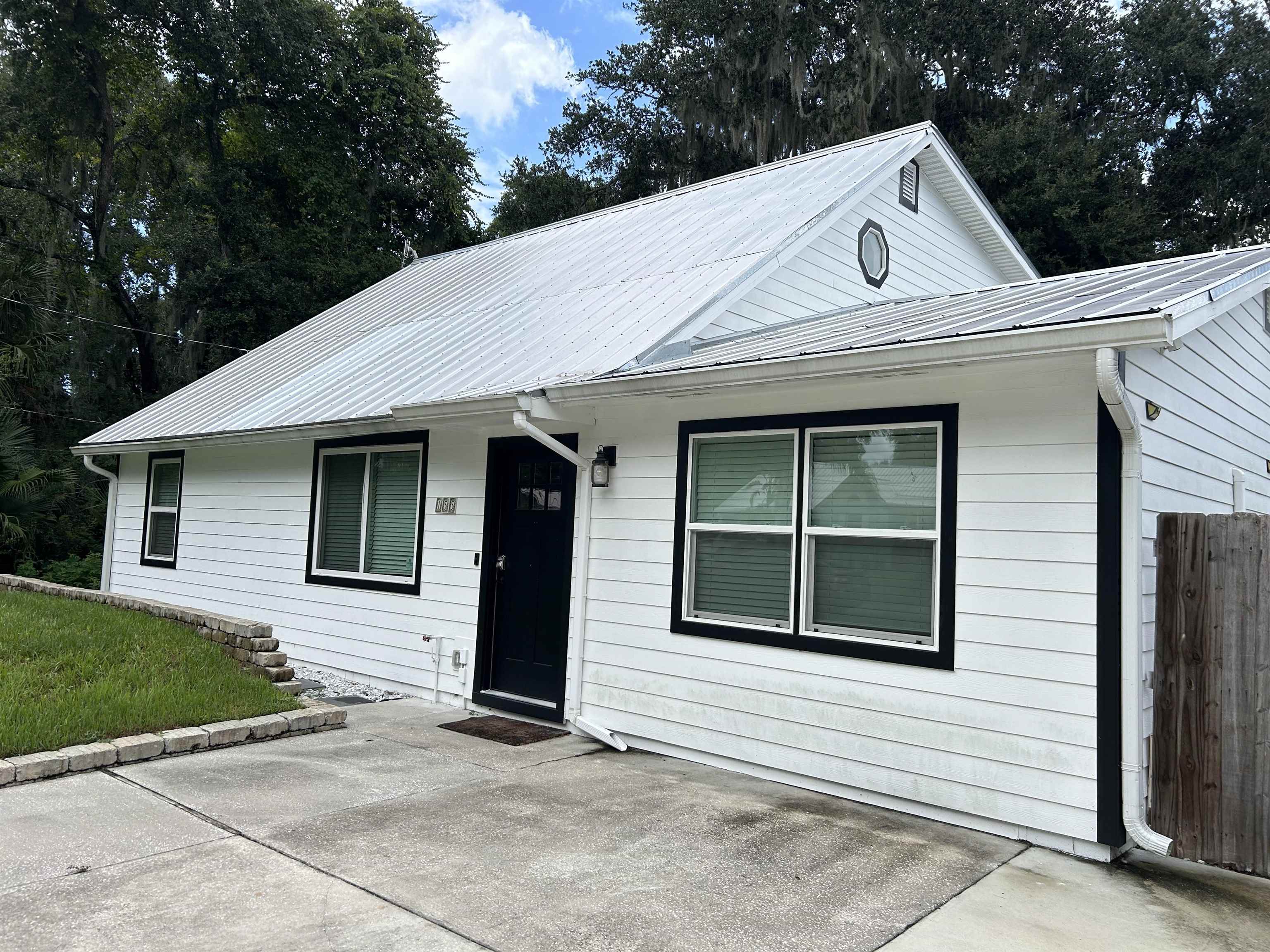 155 Drake Road St. Augustine, FL 32086 - Photo 24 of 32 a front view of a house with a garage
