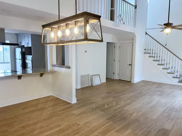 a kitchen with stainless steel appliances granite countertop a sink and wooden cabinets