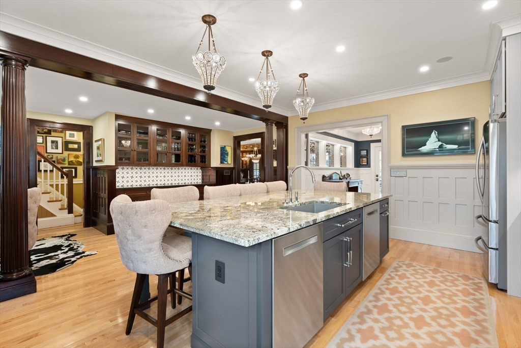 79 Wedge Street Lowell, MA 01851 - Photo 17 of 42 a dining hall with stainless steel appliances granite countertop sink stove and refrigerator
