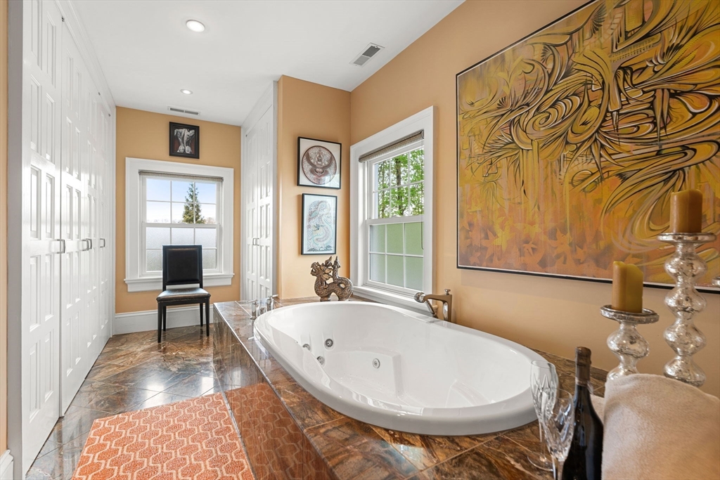 79 Wedge Street Lowell, MA 01851 - Photo 28 of 42 a bathroom with a tub and large window