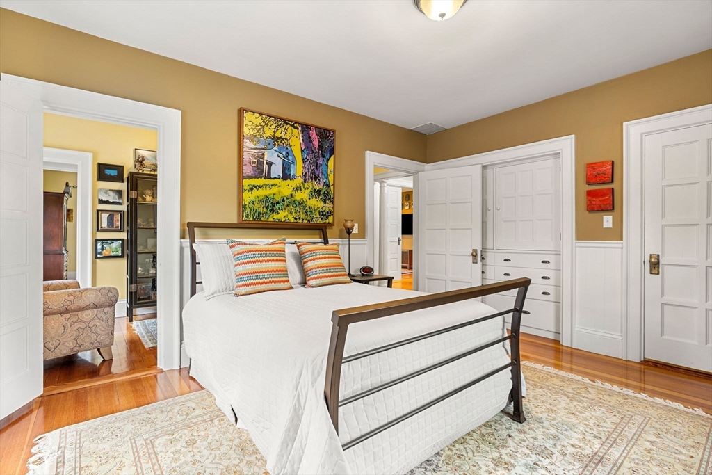 79 Wedge Street Lowell, MA 01851 - Photo 31 of 42 a bedroom with a bed and a table in it