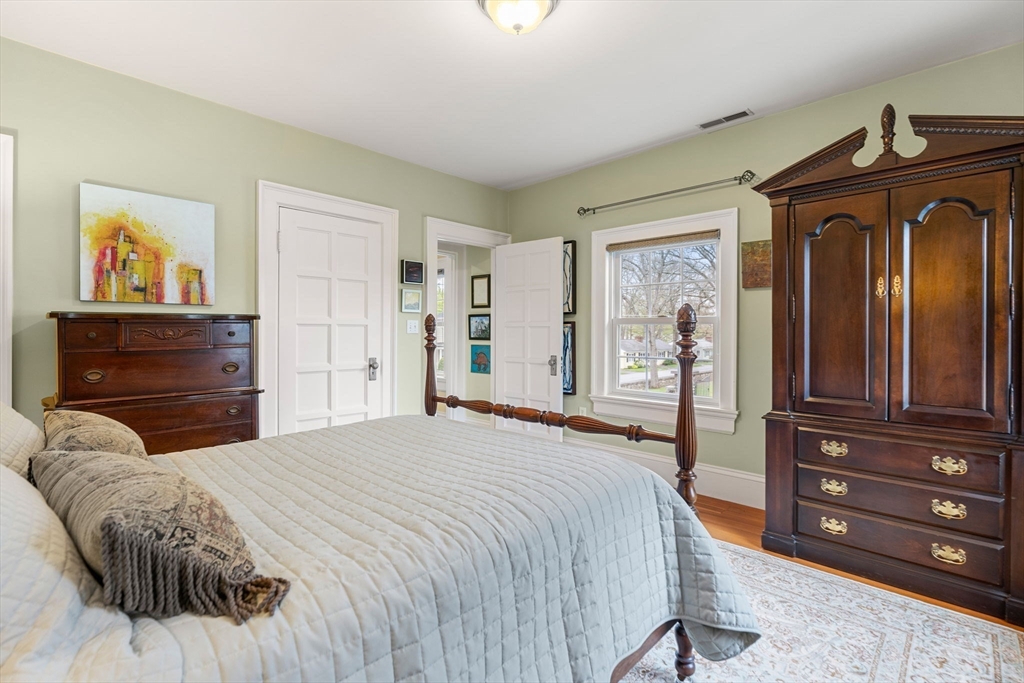 79 Wedge Street Lowell, MA 01851 - Photo 33 of 42 a bedroom with a bed and a dresser