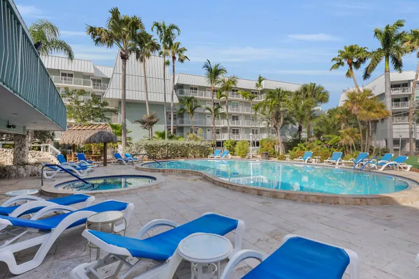 a view of yard with swimming pool and outdoor seating