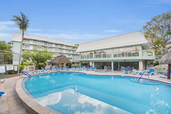 a living room with furniture couches and a flat screen tv