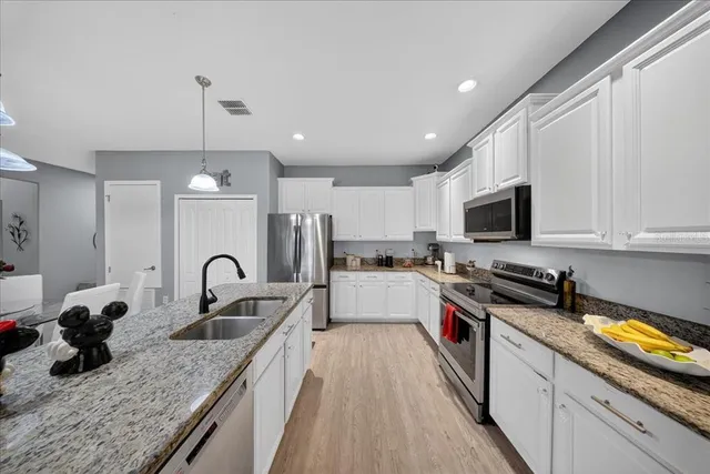 an aerial view of residential houses with outdoor space and swimming pool