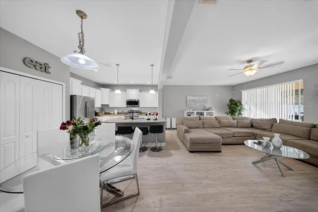 a view of a house with a big yard and potted plants