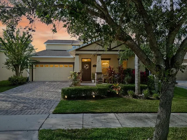 a living room with furniture kitchen view and a chandelier