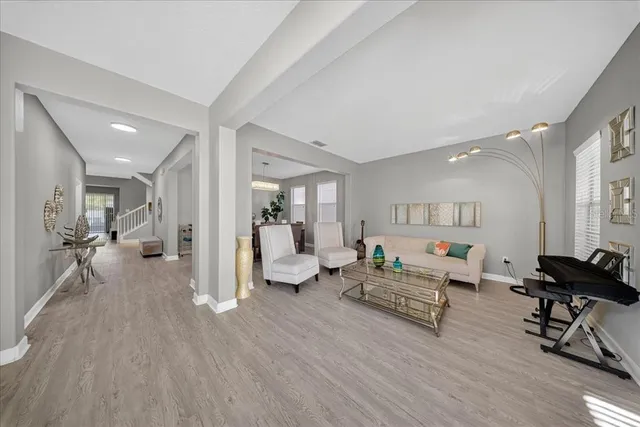 a living room with furniture and a large window