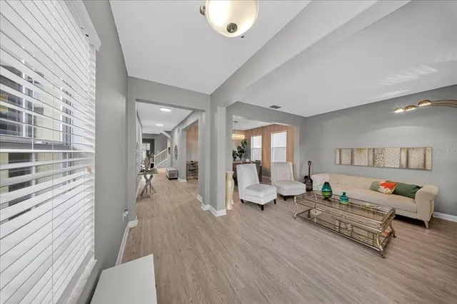 a kitchen with stainless steel appliances kitchen island granite countertop a stove refrigerator and microwave