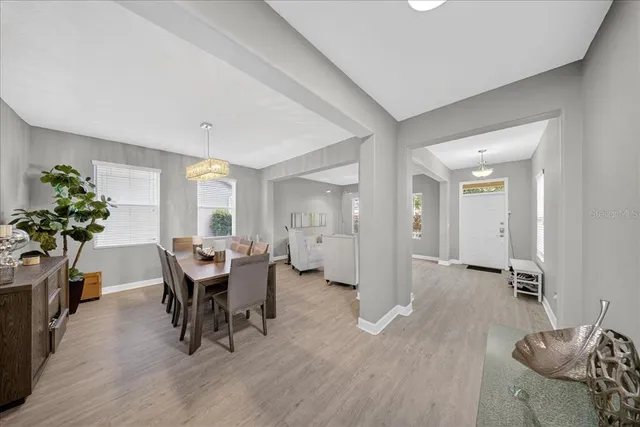 a bathroom with a sink a toilet a mirror and shower