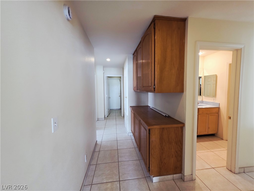 2920 Setting Sun Street Las Vegas, NV 89117 - Photo 33 of 43 Hallway leading to bathroom and other rooms with built-in storage.