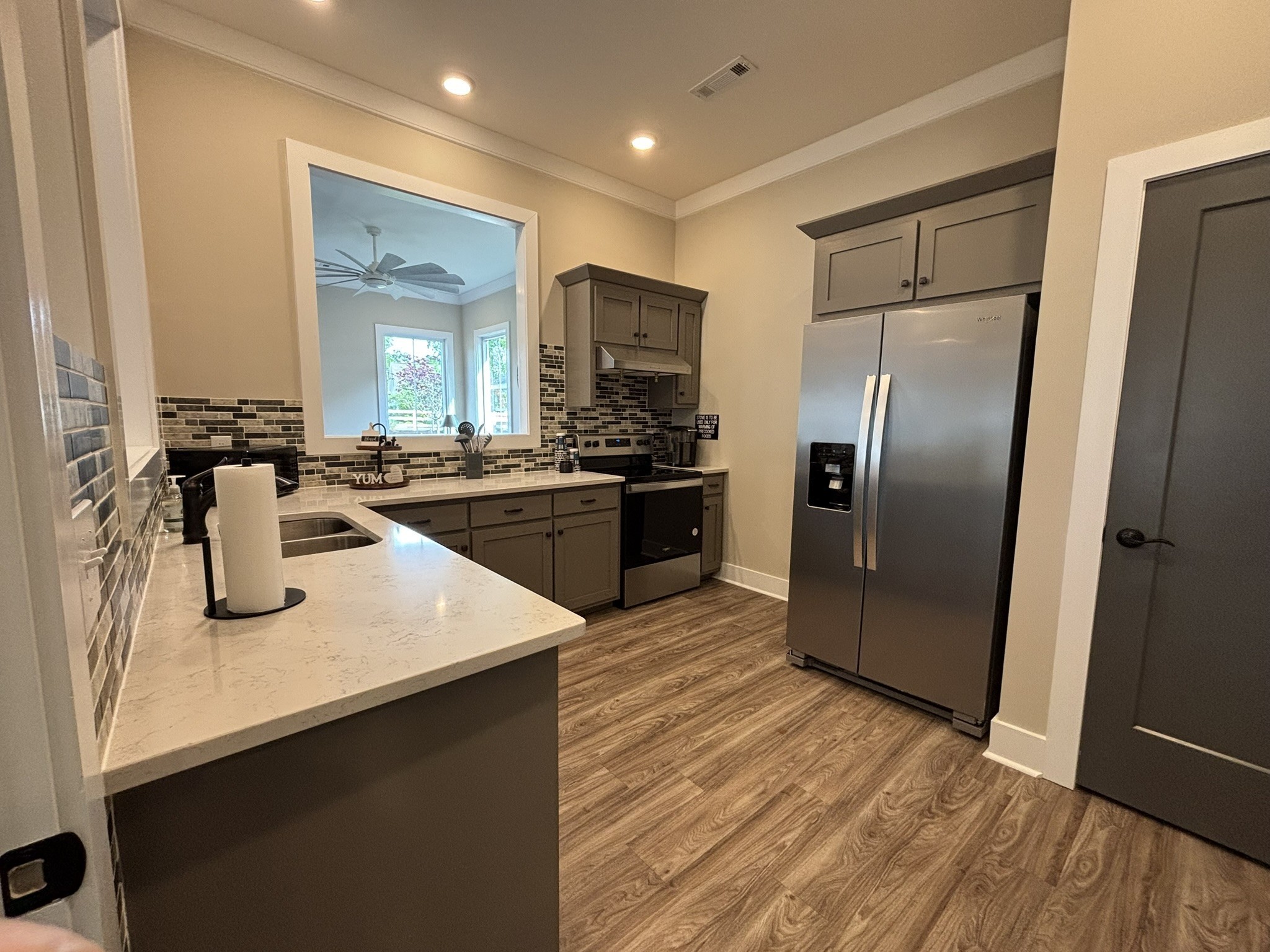 607 Rohan Drive Murfreesboro, TN 37129 - Photo 20 of 24 a kitchen with stainless steel appliances granite countertop a sink and a refrigerator