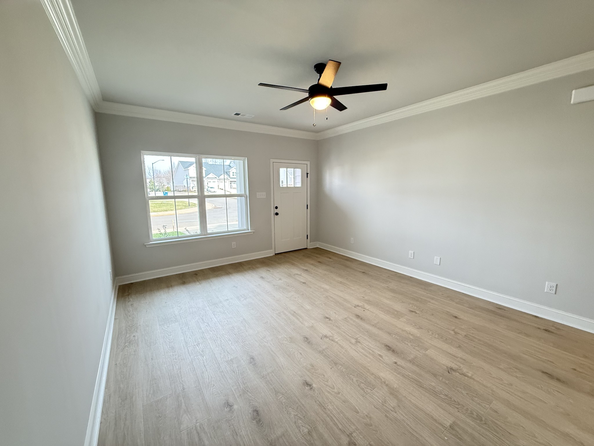 607 Rohan Drive Murfreesboro, TN 37129 - Photo 3 of 24 wooden floor in an empty room with a window