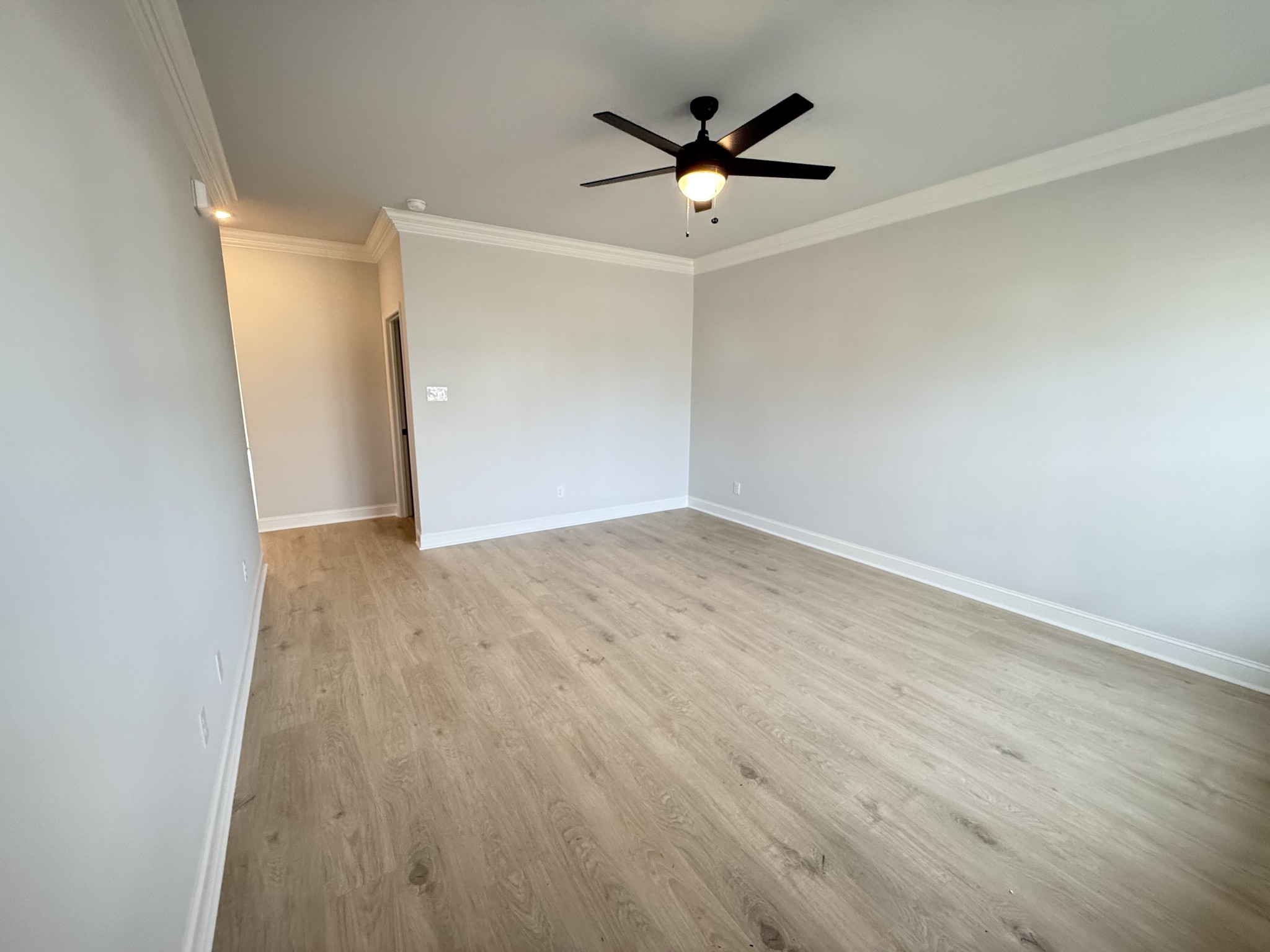 607 Rohan Drive Murfreesboro, TN 37129 - Photo 4 of 24 an empty room with wooden floor and windows