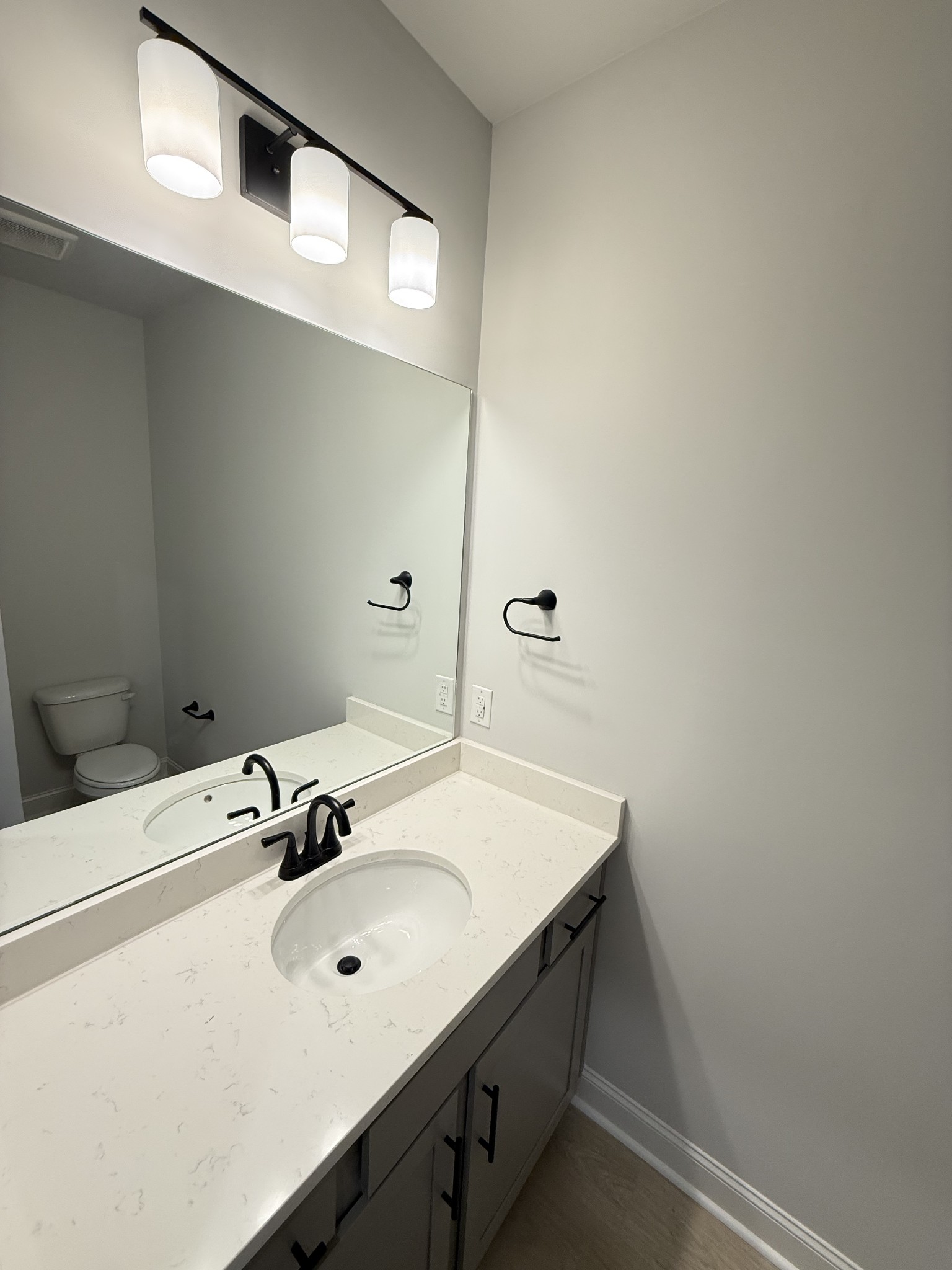 607 Rohan Drive Murfreesboro, TN 37129 - Photo 7 of 24 a bathroom with a sink and a mirror