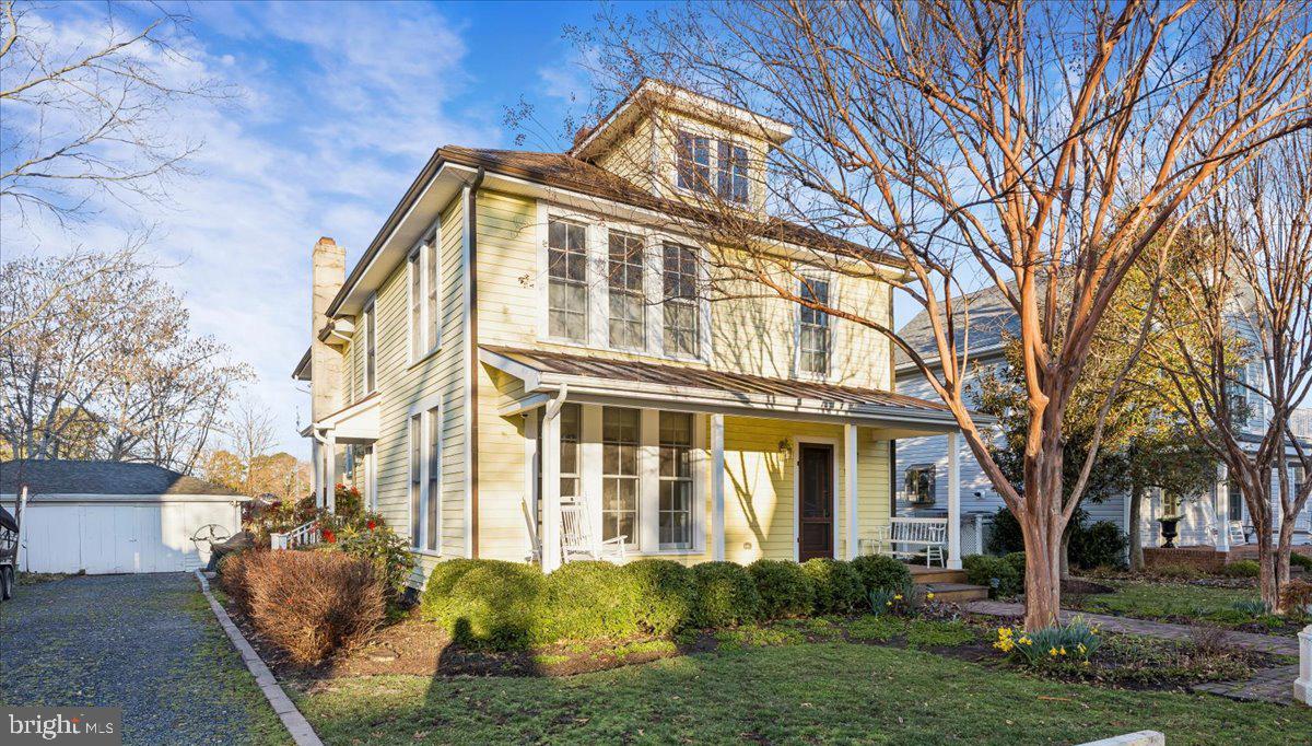 104 Myrtle Street Oxford, MD 21654 - Photo 1 of 13 a front view of a house with garden