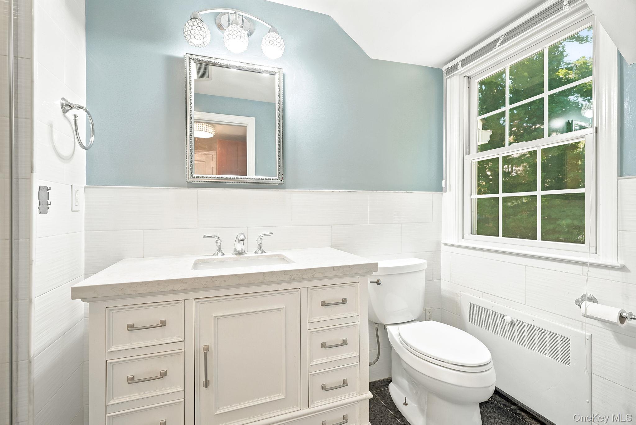1 Sheridan Road Scarsdale, NY 10583 - Photo 24 of 40 Tranquil primary bath with window overlooking private yard