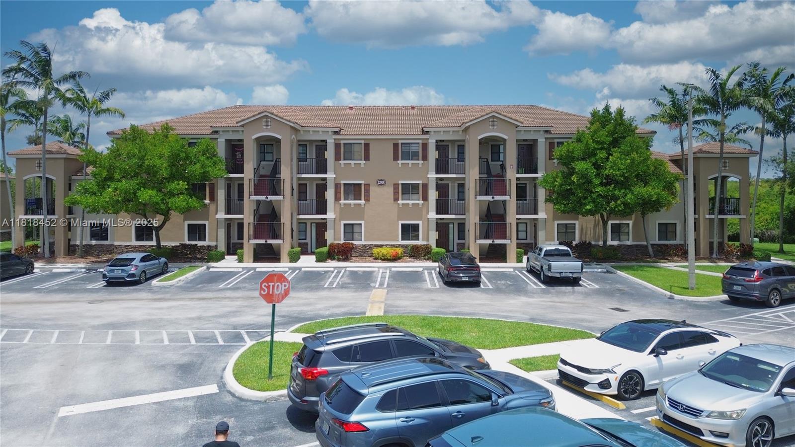 22901 Southwest 88th Place, Unit 101 Cutler Bay, FL 33190 - Photo 14 of 16 a front view of a house with swimming pool and porch