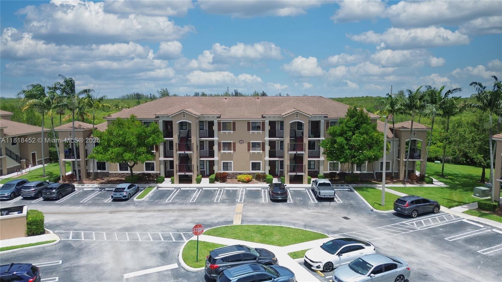 22901 Southwest 88th Place, Unit 101 Cutler Bay, FL 33190 - Photo 15 of 16 a view of a house with swimming pool and sitting area