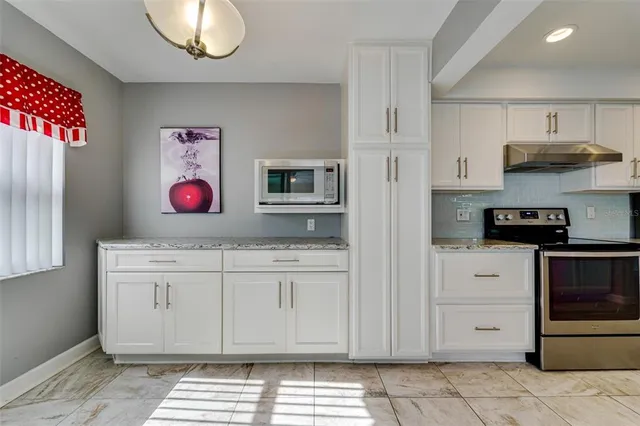 an aerial view of a residential building and lake view