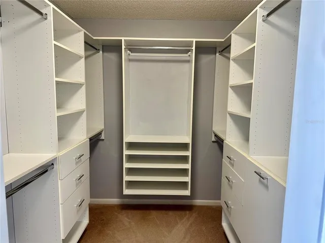 an aerial view of a residential building and lake view