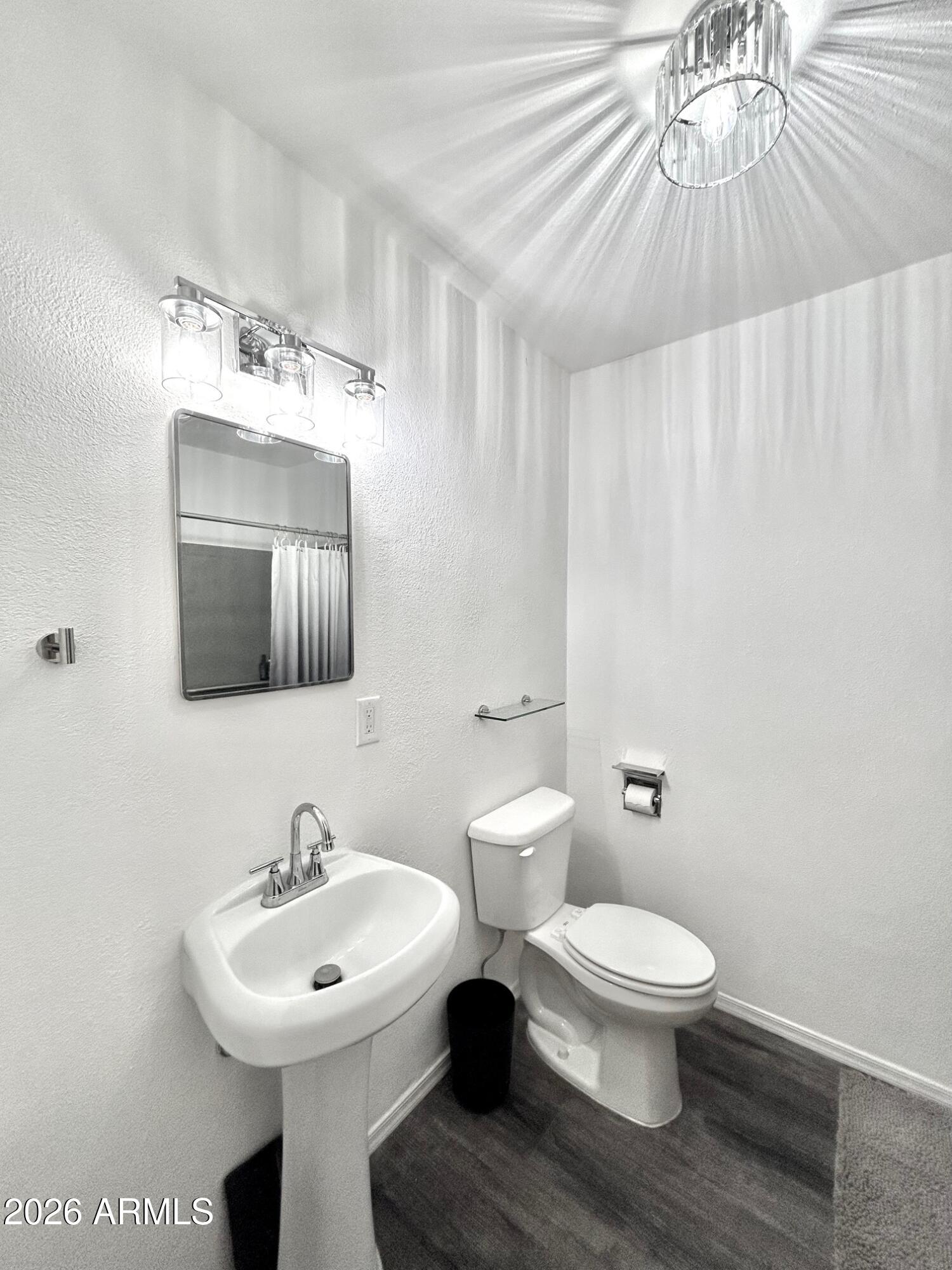 702 Paxton Avenue Miami, AZ 85539 - Photo 11 of 15 a bathroom with a toilet sink and mirror