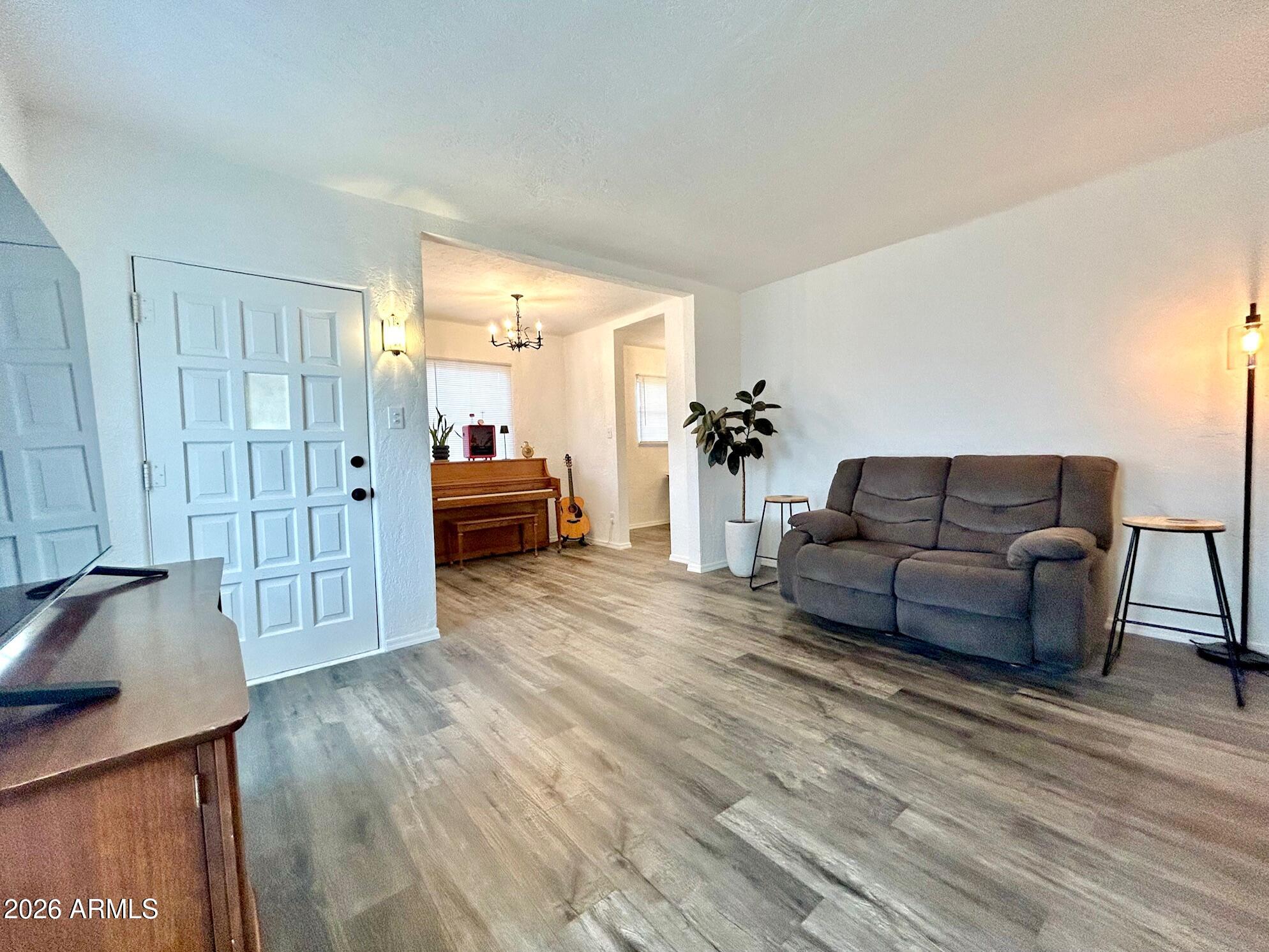 702 Paxton Avenue Miami, AZ 85539 - Photo 14 of 15 a living room with furniture and wooden floor