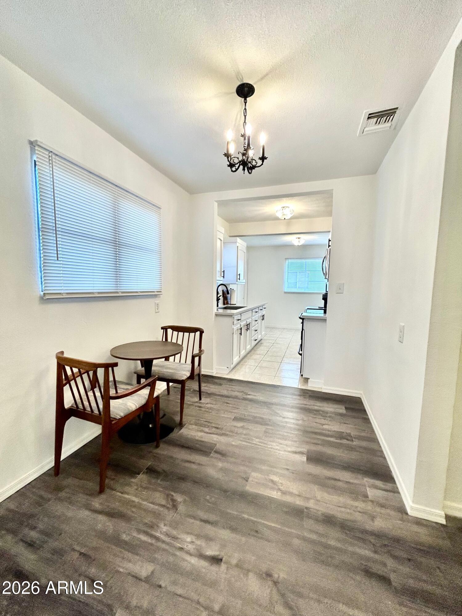 702 Paxton Avenue Miami, AZ 85539 - Photo 5 of 15 a view of dining room with furniture and window