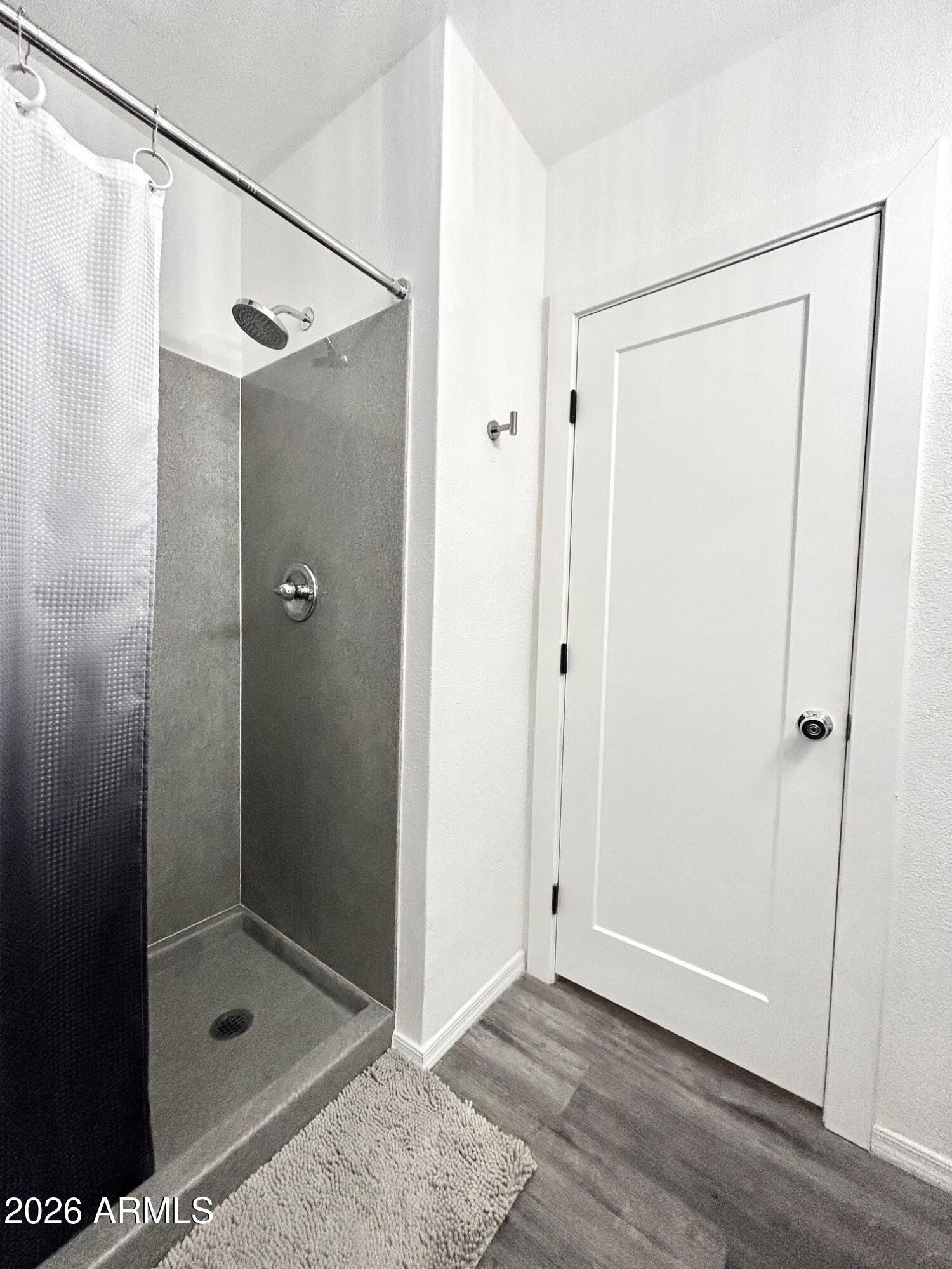 702 Paxton Avenue Miami, AZ 85539 - Photo 10 of 15 a bathroom with a glass shower door
