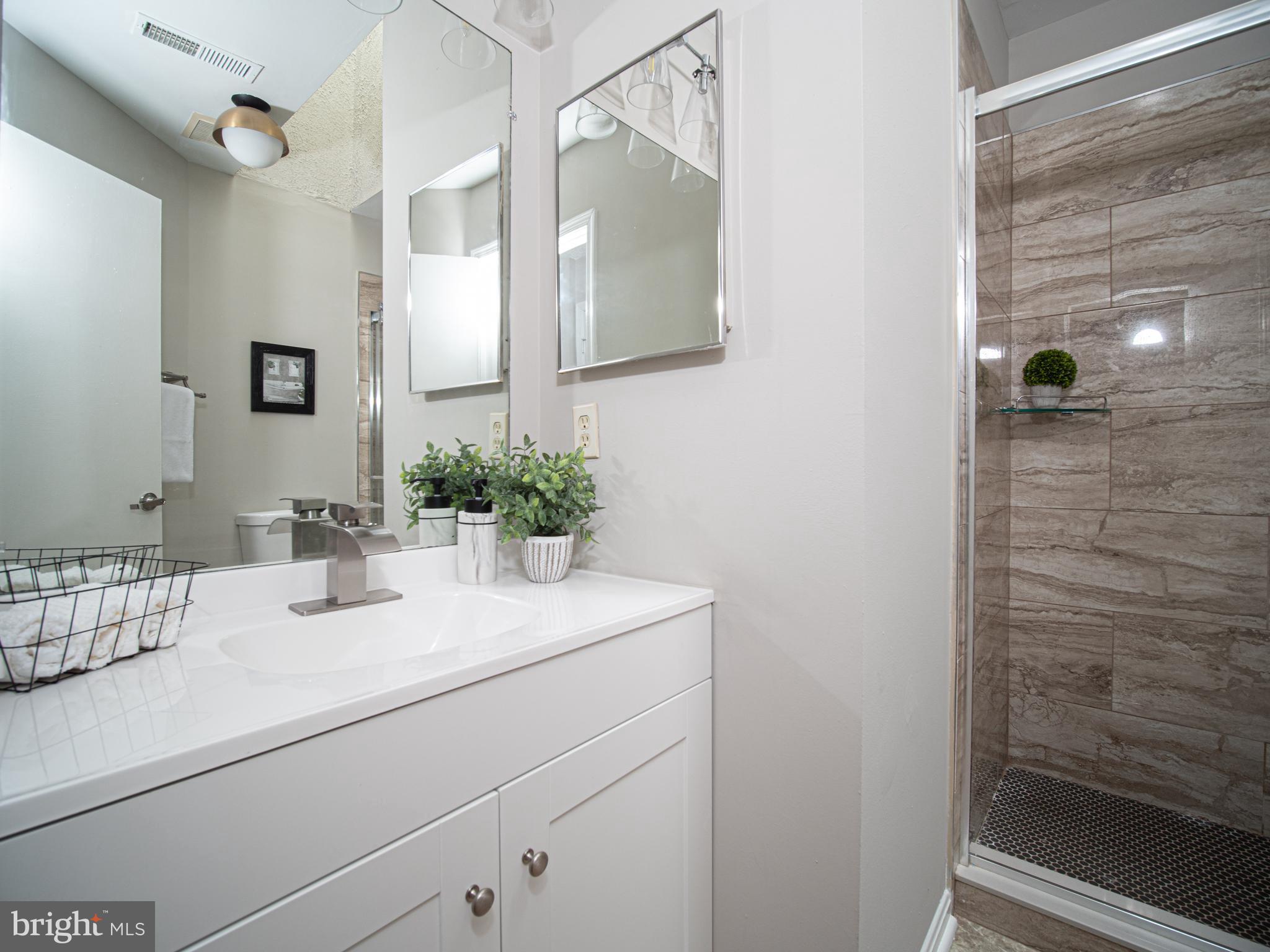 918 Lake Overlook Drive Bowie, MD 20721 - Photo 12 of 29 a bathroom with a sink and a mirror
