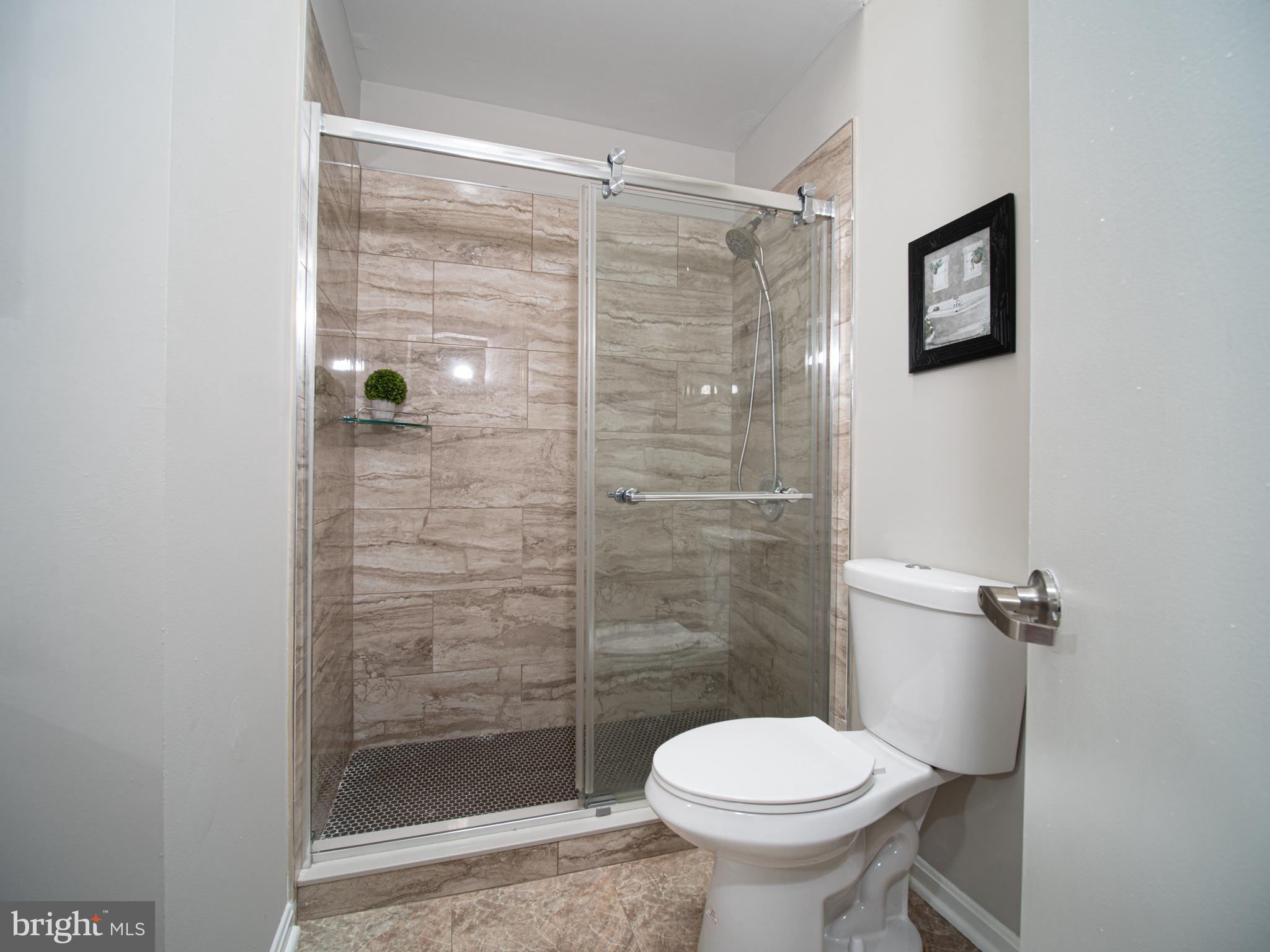 918 Lake Overlook Drive Bowie, MD 20721 - Photo 13 of 29 a bathroom with a shower and toilet