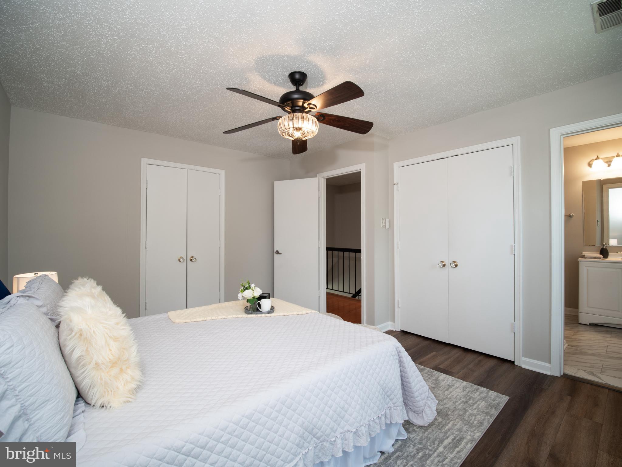 918 Lake Overlook Drive Bowie, MD 20721 - Photo 17 of 29 a bedroom with a bed and a chandelier