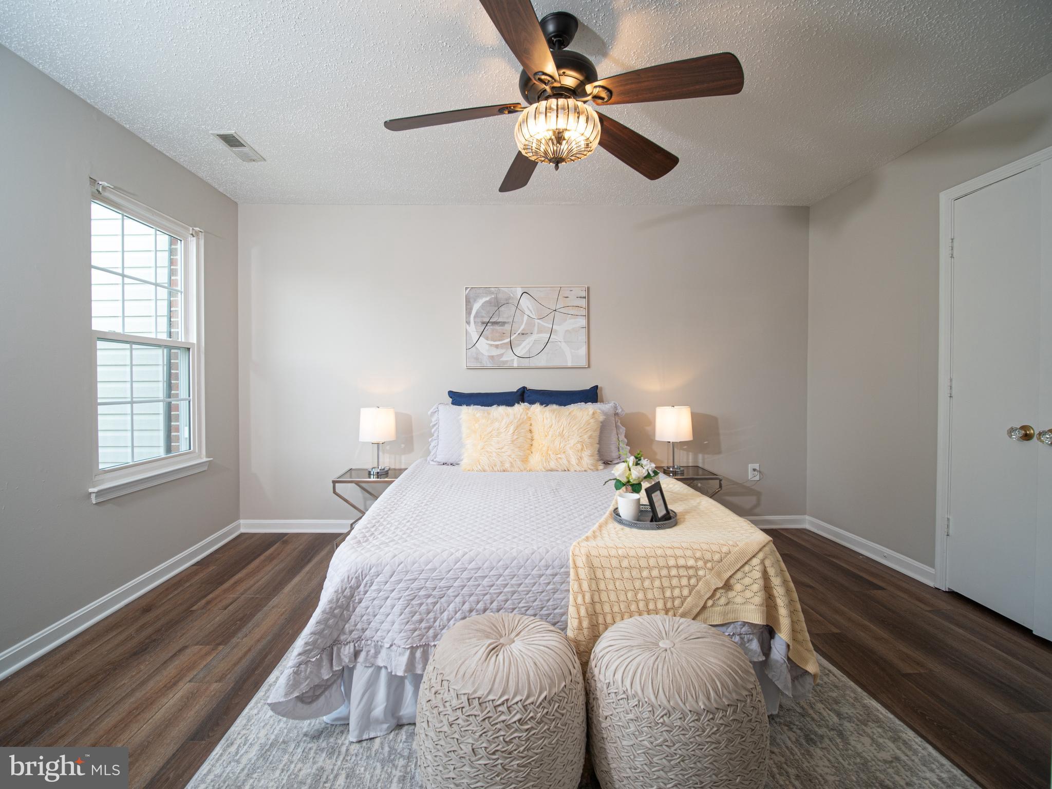 918 Lake Overlook Drive Bowie, MD 20721 - Photo 18 of 29 a bedroom with a bed and wooden floor