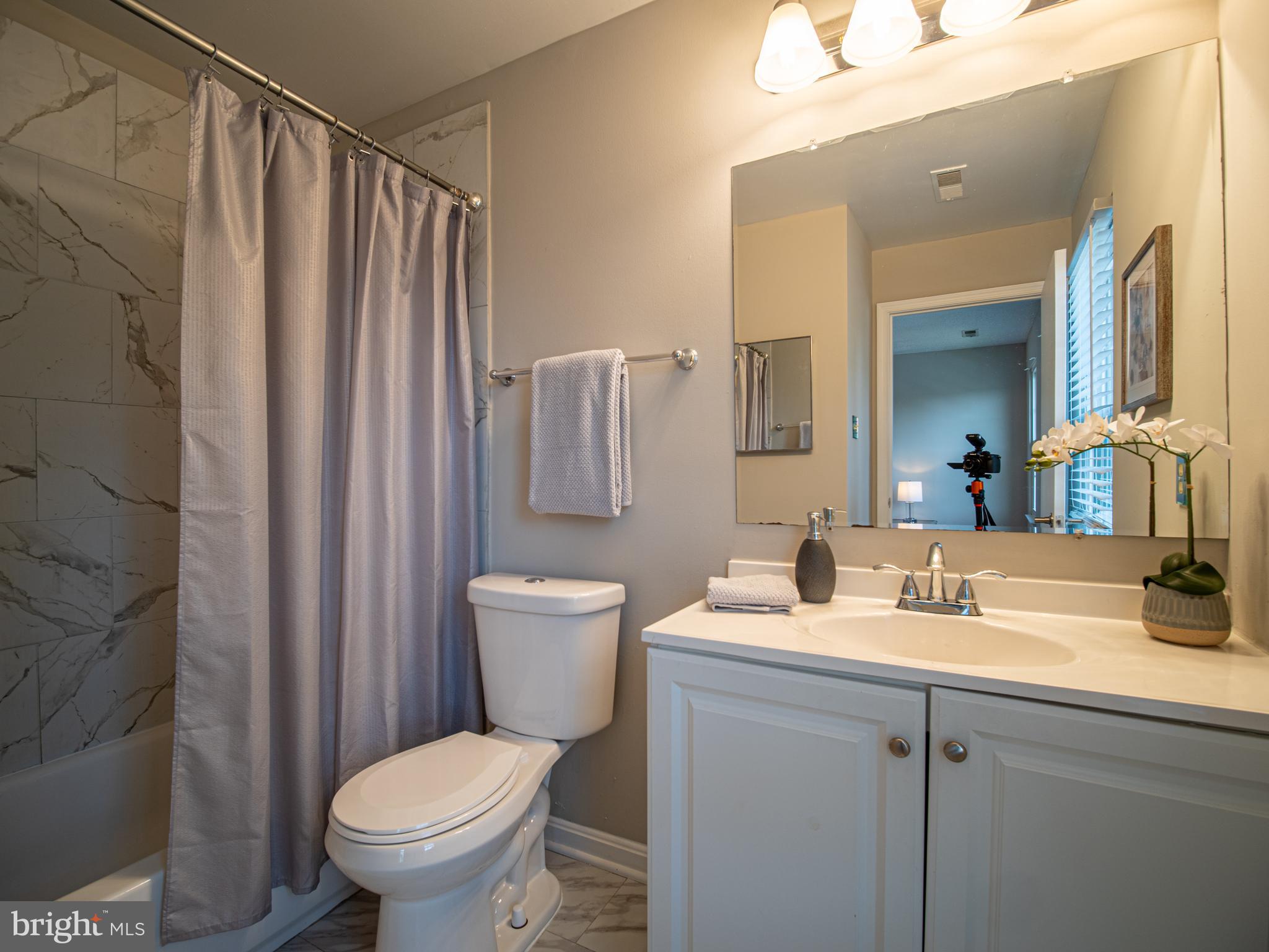918 Lake Overlook Drive Bowie, MD 20721 - Photo 19 of 29 a bathroom with a sink toilet and shower