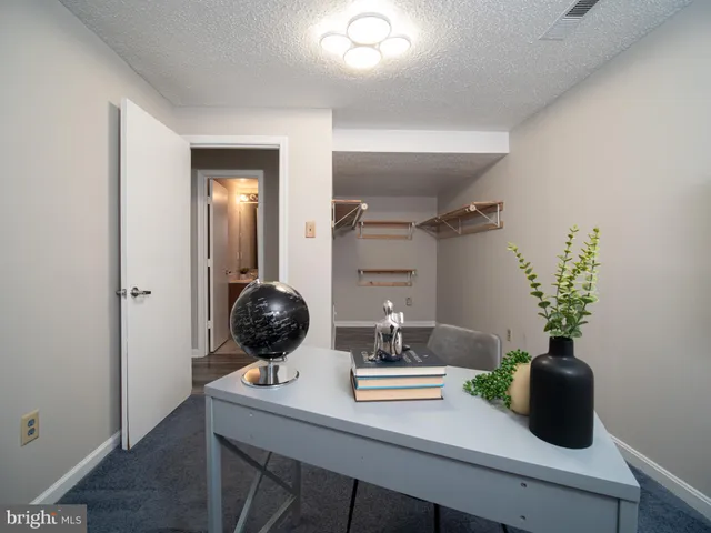 a dining room with table and chairs