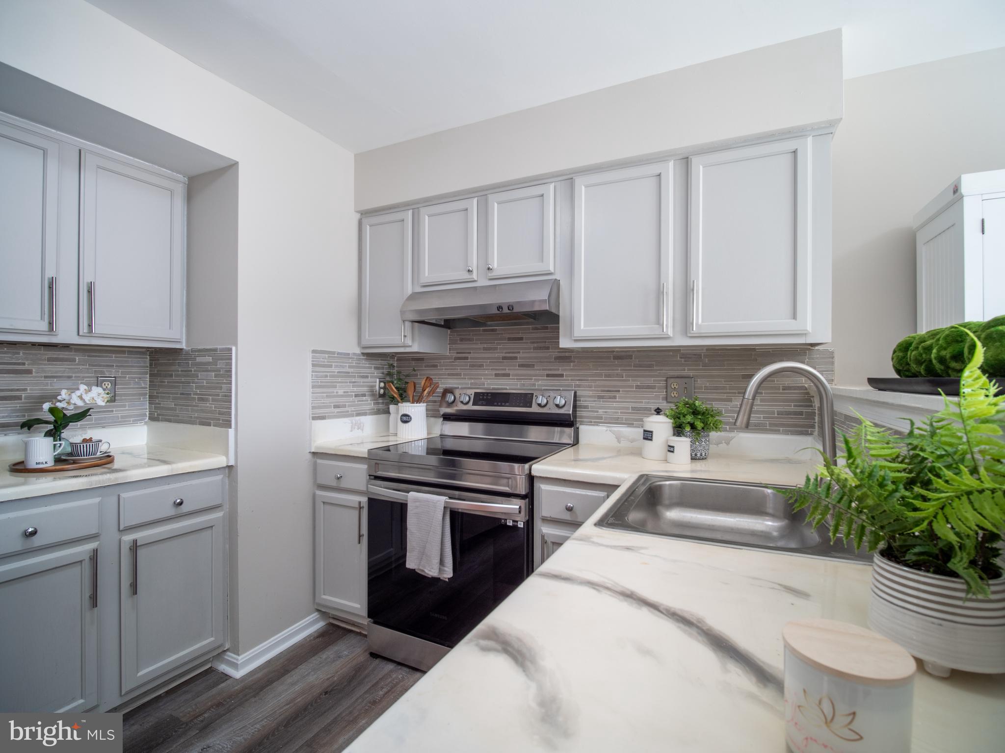 918 Lake Overlook Drive Bowie, MD 20721 - Photo 7 of 29 a kitchen with a sink and cabinets