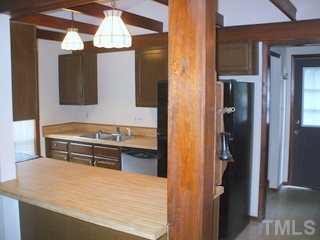 5201 Round Hill Lane Raleigh, NC 27616 - Photo 7 of 14 a kitchen with stainless steel appliances granite countertop a refrigerator and a stove
