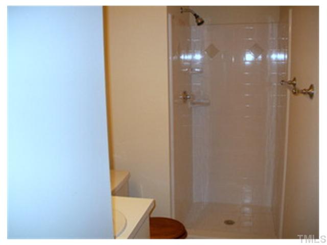 5201 Round Hill Lane Raleigh, NC 27616 - Photo 10 of 14 a bathroom with a shower