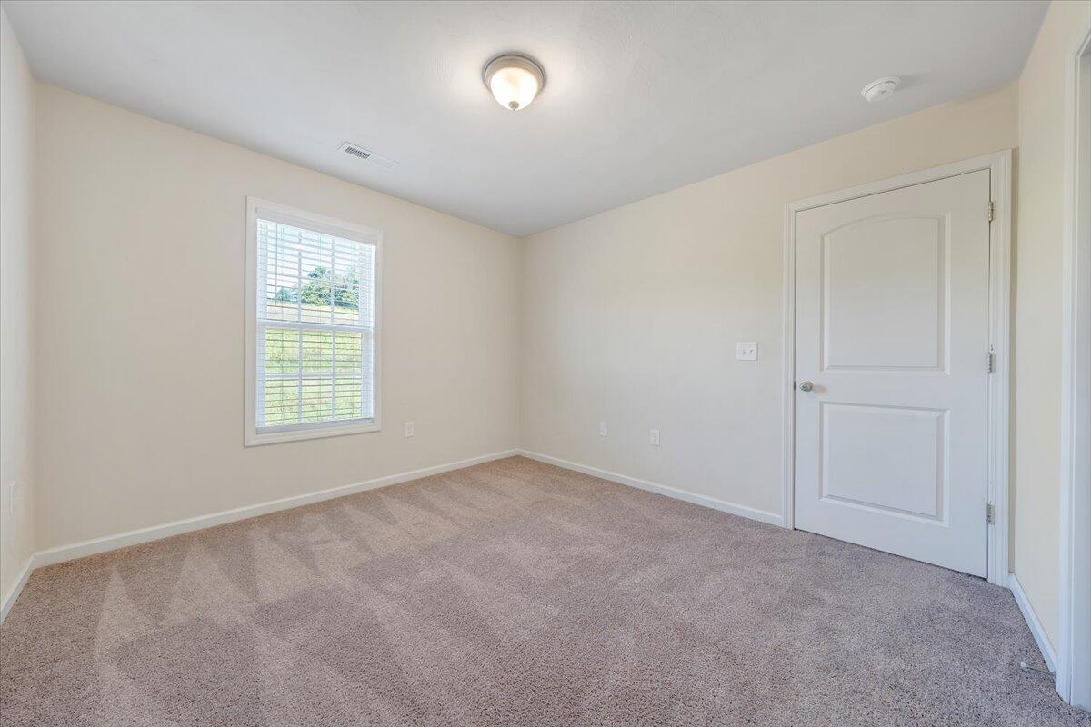 416 Old Fort Road Rocky Mount, VA 24151 - Photo 14 of 28 an empty room with windows
