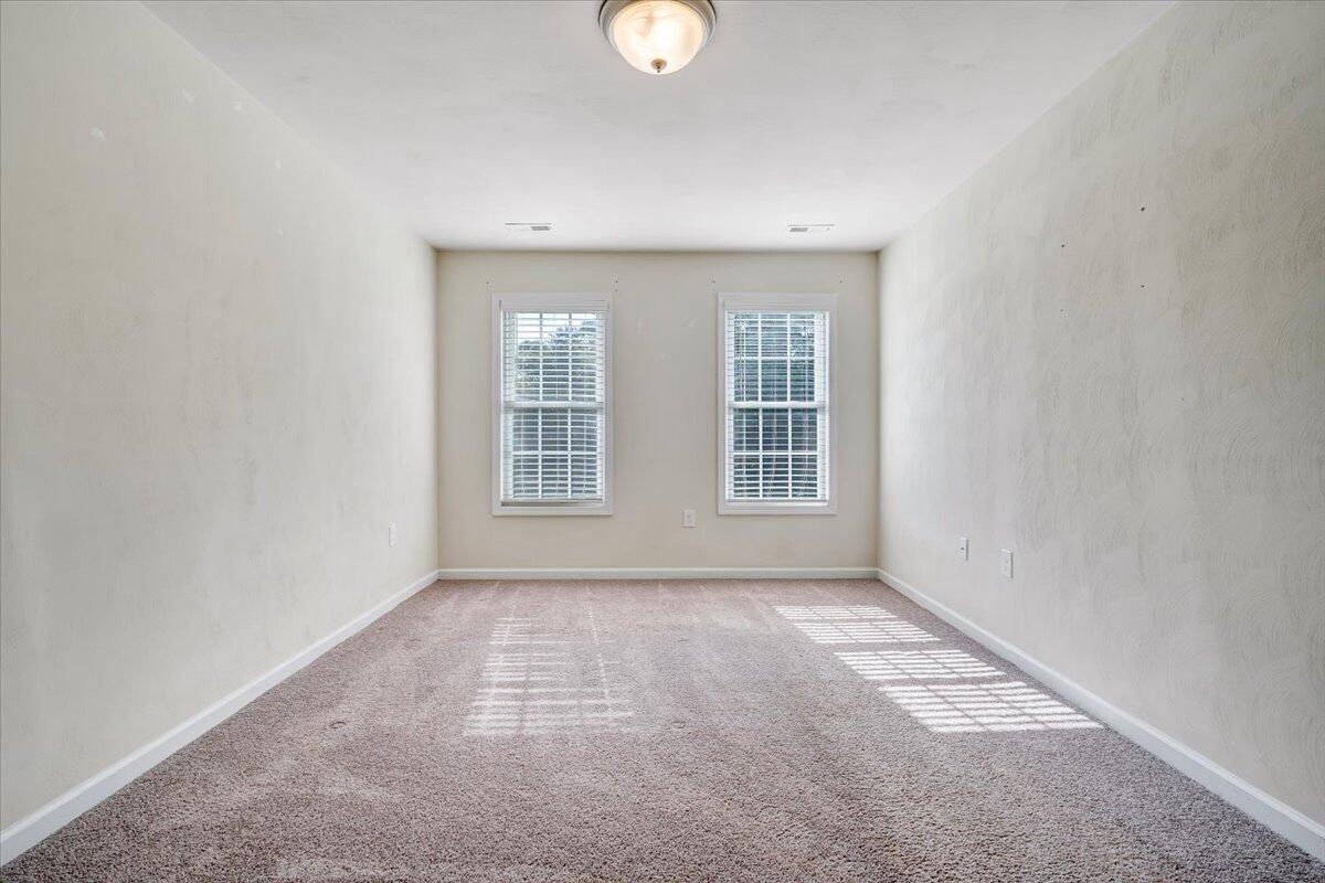 416 Old Fort Road Rocky Mount, VA 24151 - Photo 19 of 28 an empty room with windows and yard