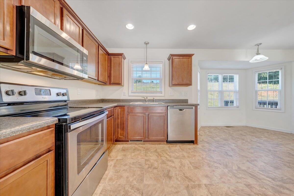 416 Old Fort Road Rocky Mount, VA 24151 - Photo 6 of 28 a kitchen with stainless steel appliances granite countertop a stove and a sink