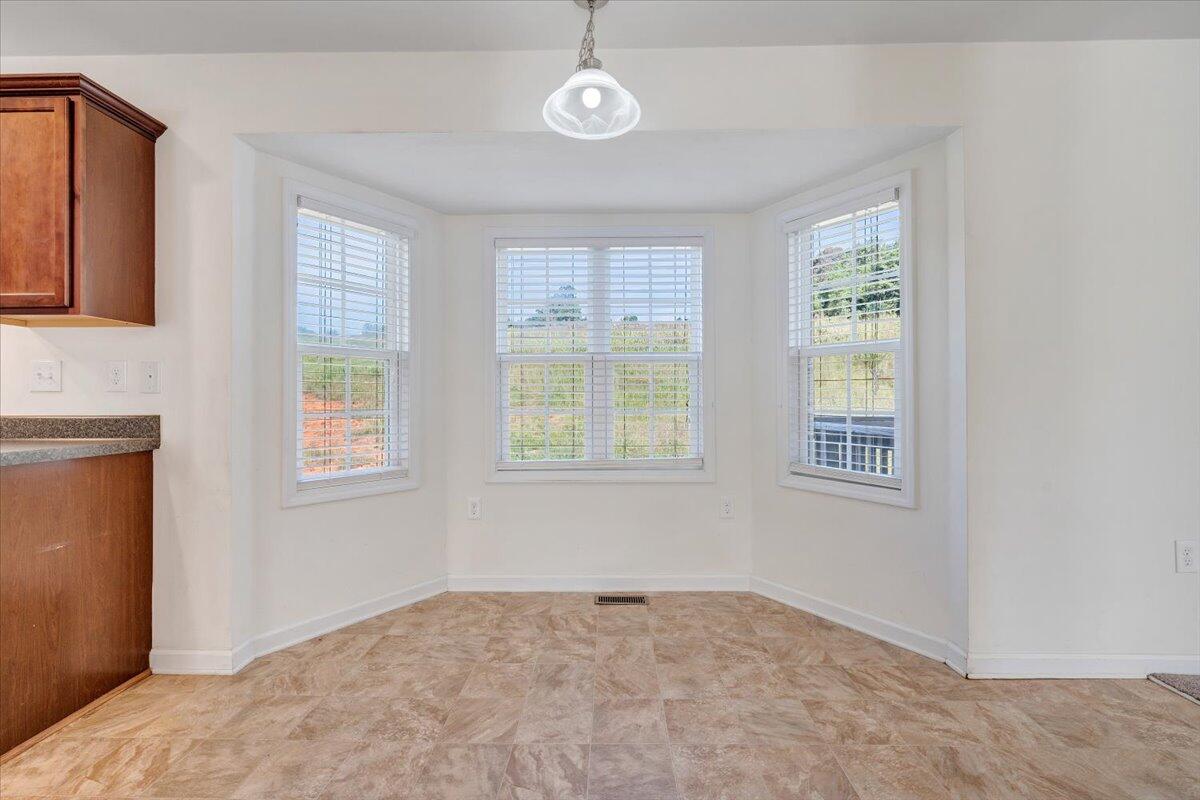 416 Old Fort Road Rocky Mount, VA 24151 - Photo 9 of 28 a view of an empty room with a window