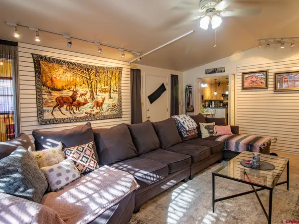 a living room with furniture and a large window
