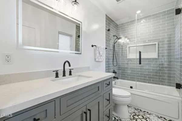 a bathroom with a sink a toilet and a bathtub