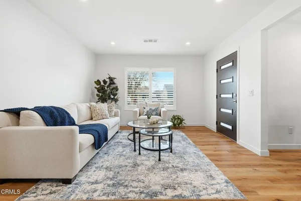 a living room with furniture and window