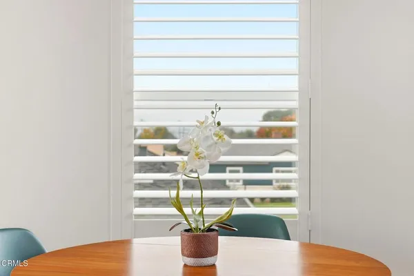a view of a vase of flowers sitting on a table