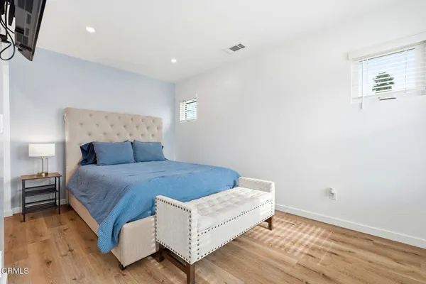 a bed room with a bed and a night stand