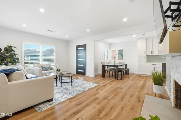 a living room with furniture and a table
